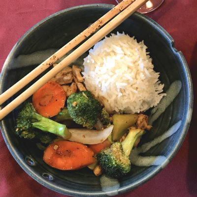 bowl with rice, brocolli, carrots, chicken, onion, with chopsticks and bottle of Amista Vineyards Fusion, Sonoma County, Dry Creek Valley, Morninsong Vineyards