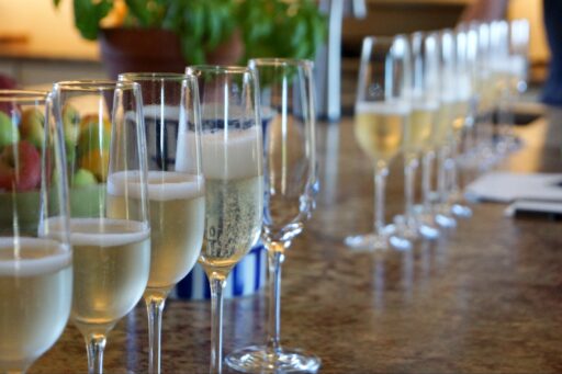rows of sparkling wine glasses for a sparkling wine dosage trial