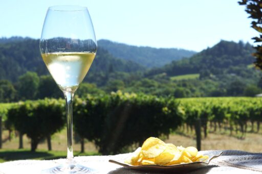 Blanc de Blanc pairing with truffle potato chips with vineyard in the background